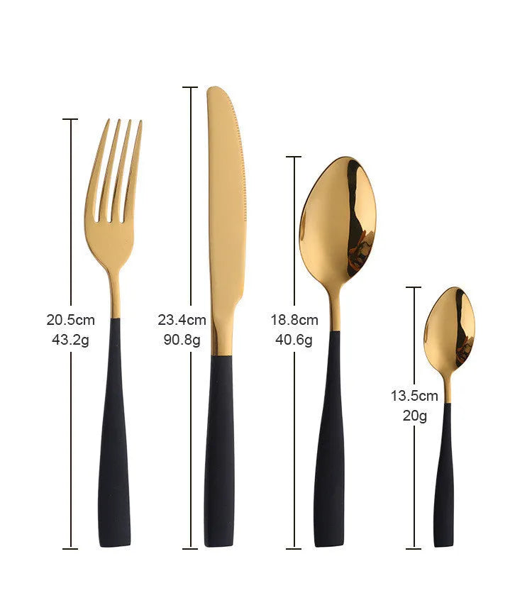 Black stainless steel four-piece cutlery set with mirror-polished finish on a plain surface