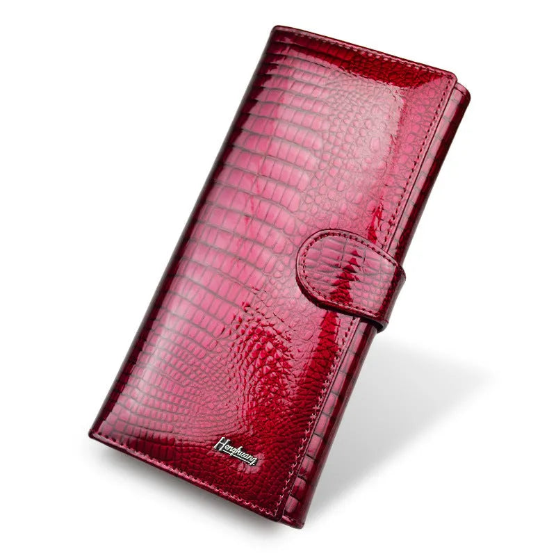 Women's leather coin purse with patent finish and crocodile pattern in red, wine red, and black colour options