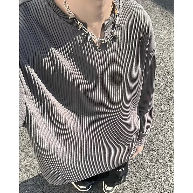 Plus size women's loose grey striped texture long sleeve pullover top on a hanger.