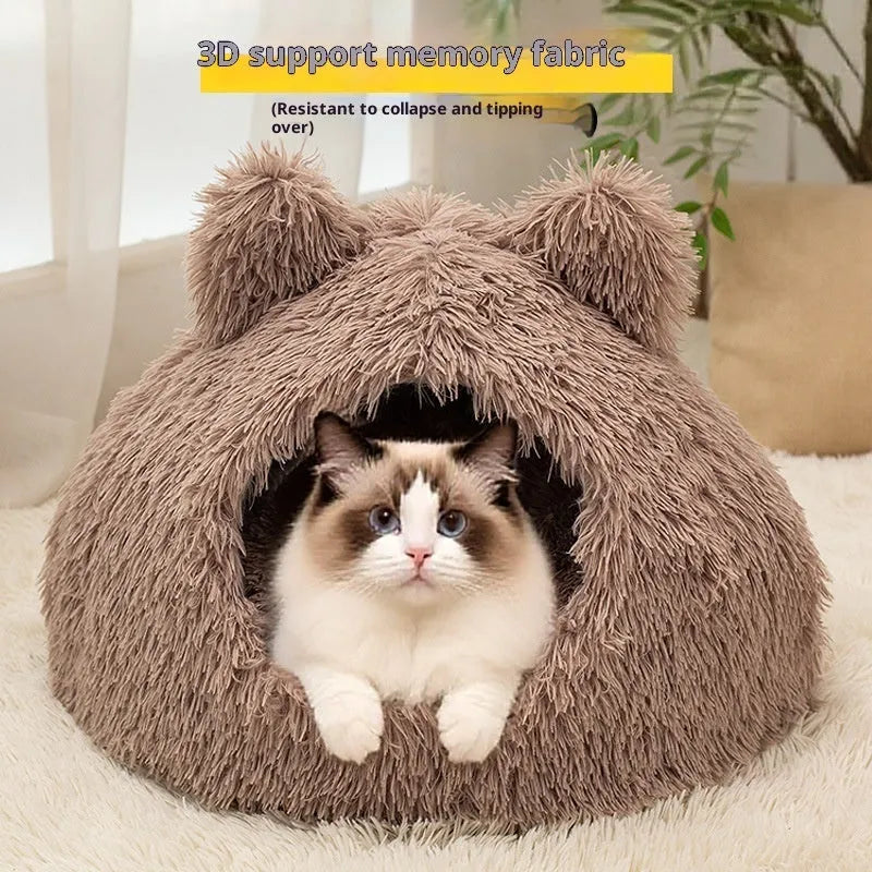 Large semi-closed flannel cat nest in dark gray on a floor, with soft plush interior visible