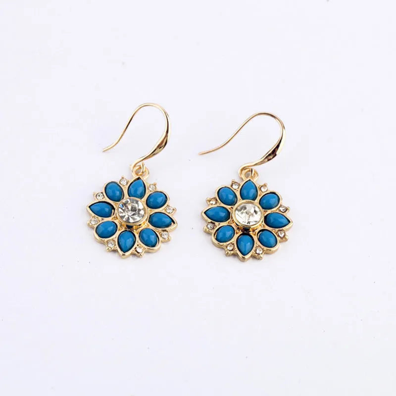 Pair of alloy flower-shaped earrings with artificial gemstone inlay, available in blue or red for women