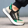 Black green plastic steel toe safety overshoes with large mesh panels and low-top design