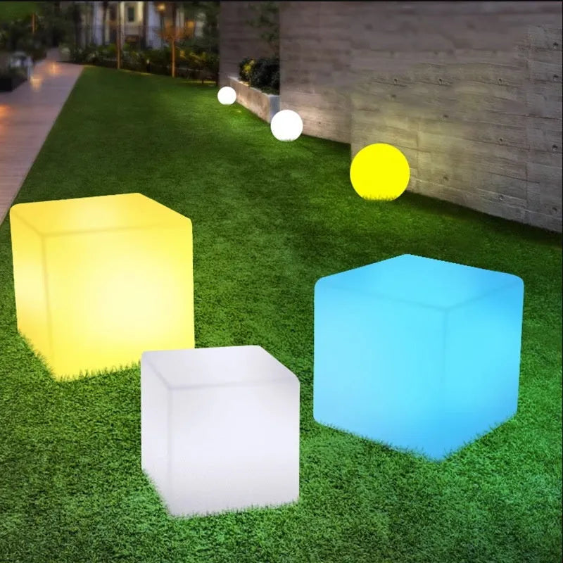 Modern square LED cube stool light for outdoor gardens, available in multiple sizes with solar or rechargeable power