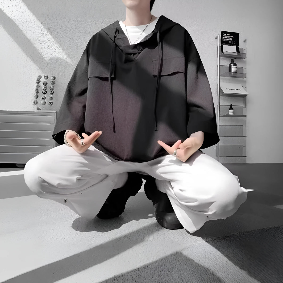 Man wearing a hooded short sleeve t-shirt in lightweight polyester fabric for summer