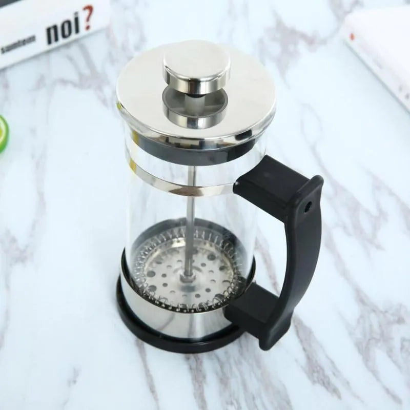 Small glass pour-over coffee maker with stainless steel filter, 350ml capacity.