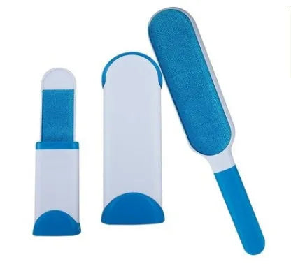 Blue reusable pet hair removal brush with self-cleaning base on a grey sofa.