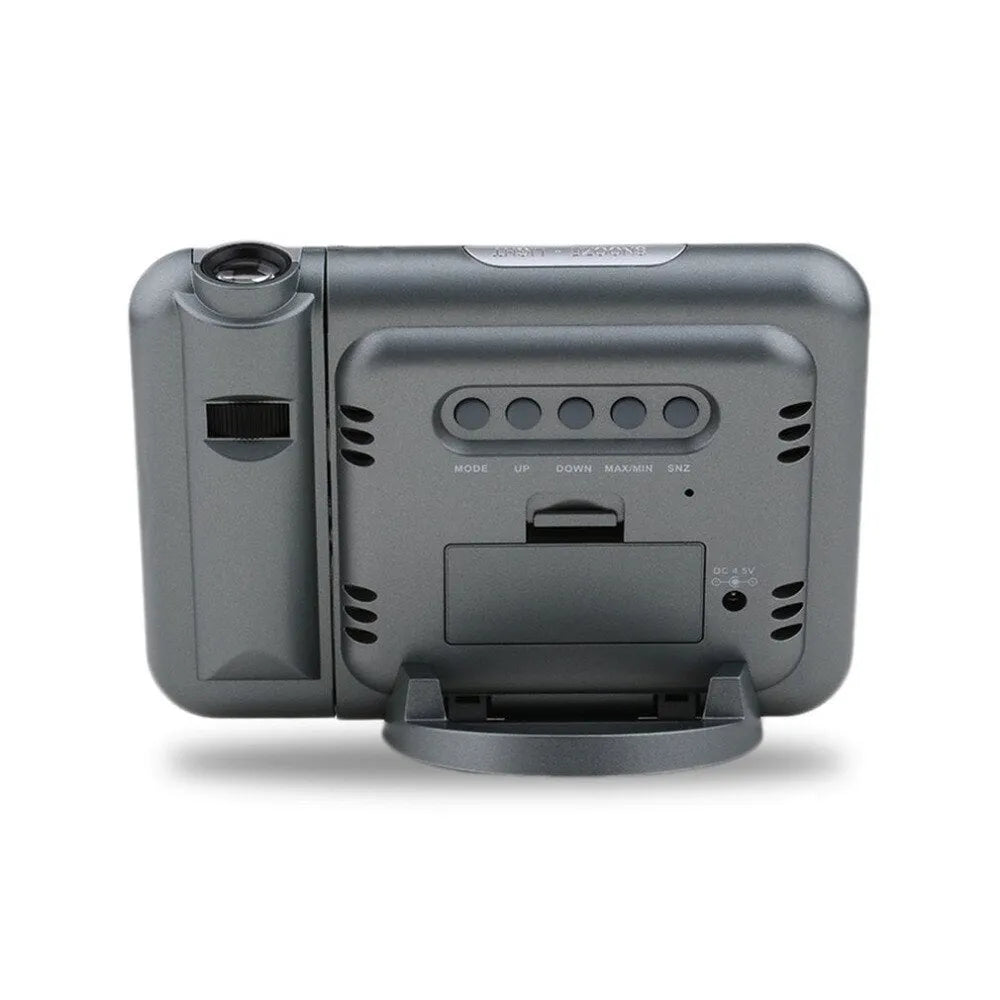 Black digital projection alarm clock showing time, temperature and humidity on its display