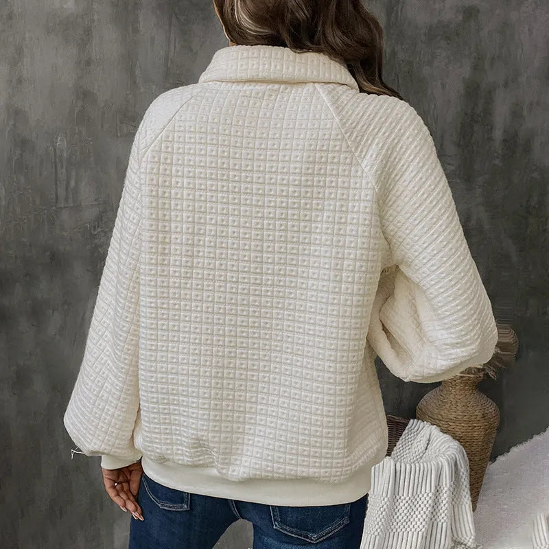 Women's milky white textured polo collar thick knit sweater on a hanger