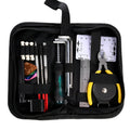 Black compact case open to reveal a guitar repair and maintenance tool kit for guitars, basses, mandolins, and banjos.
