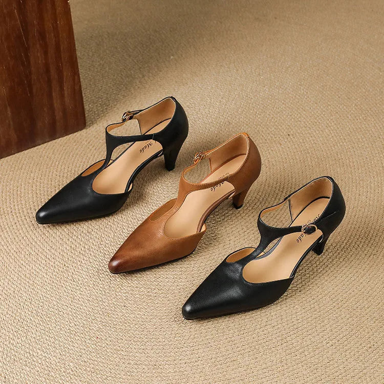 Brown retro women's T-strap closed-toe sandals with a 6-8cm heel on a wooden floor.
