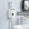 Wall-mounted automatic toothpaste dispenser in blue, grey, and pink colours