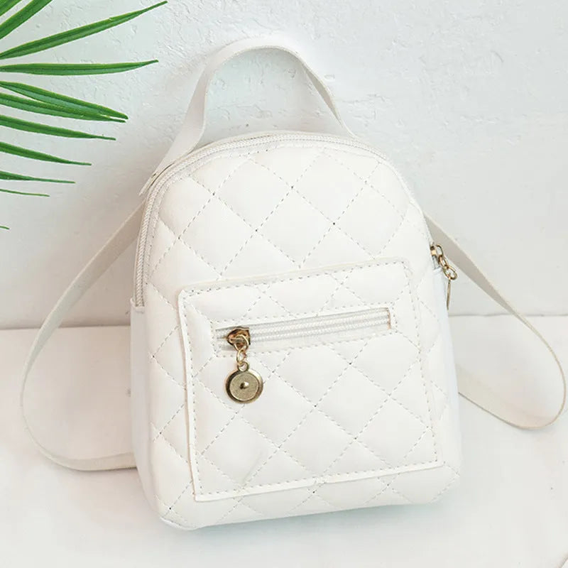 Girls square hard PU backpack with embroidery detail in black, pink or white, showing soft handle and outer pocket.