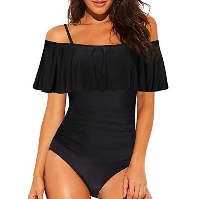 Black one-piece swimsuit with ruffled halter strap and side cut-out details
