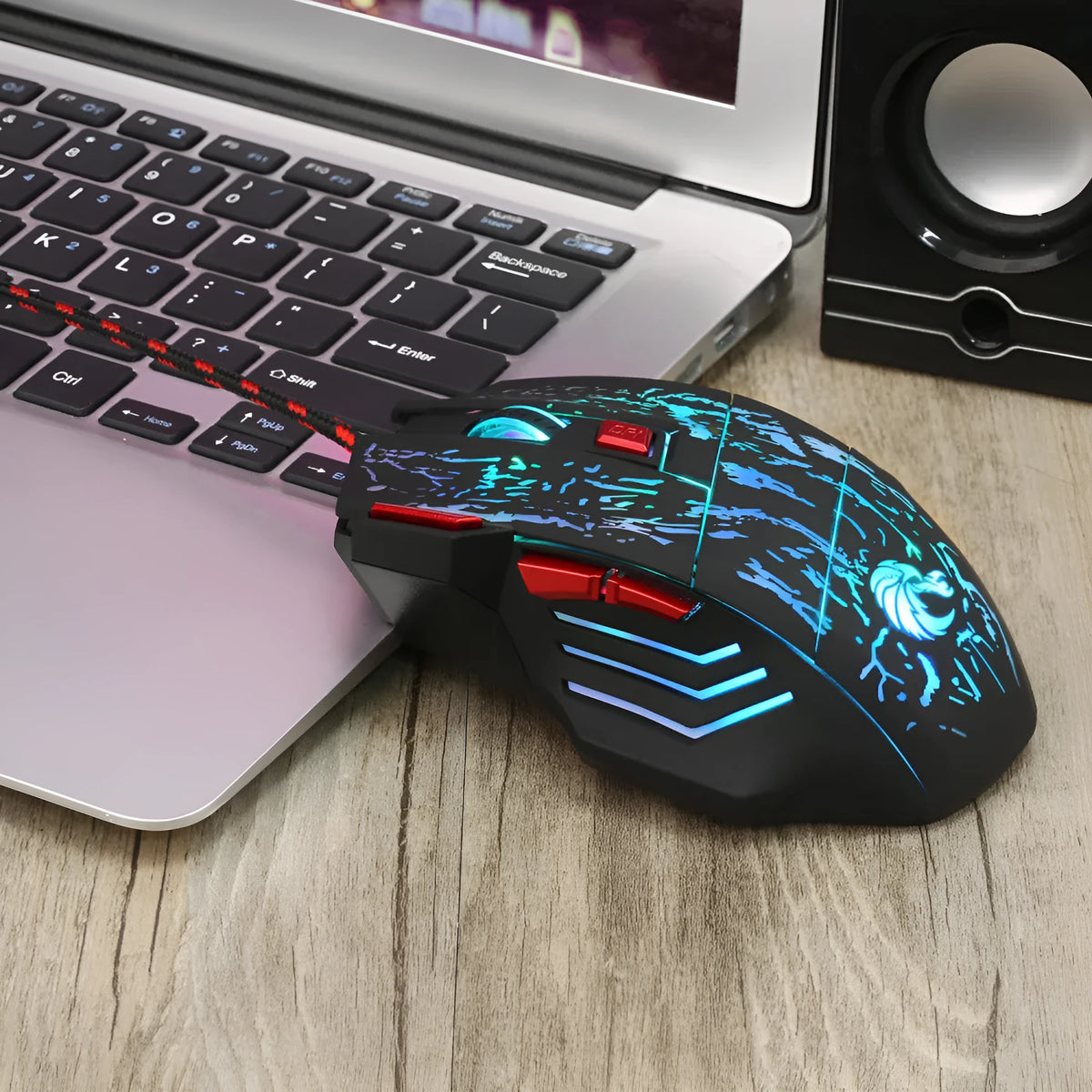 Water Crack colourful luminous gaming mouse with ergonomic design and USB cable on desktop