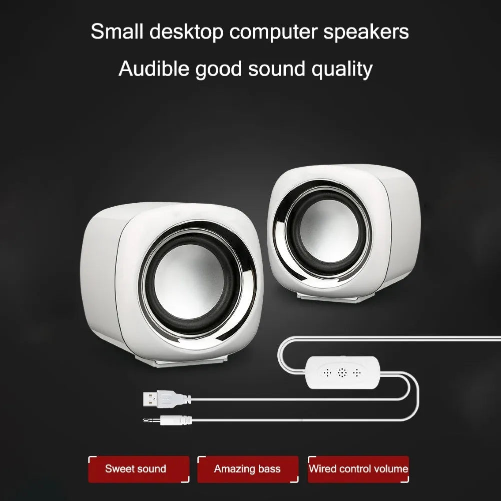 Pair of black cubic desktop speakers measuring 7.2cm with volume scroll wheel and 3.5mm cable