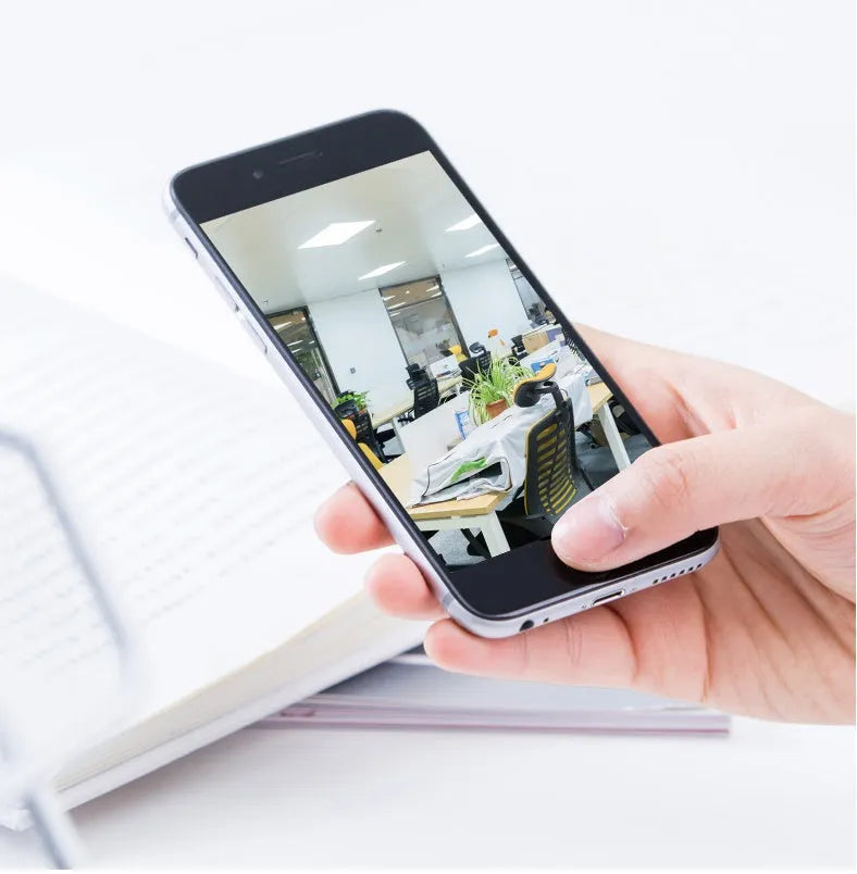 Indoor 360-degree rotating WiFi security camera with HD resolution on flat surface