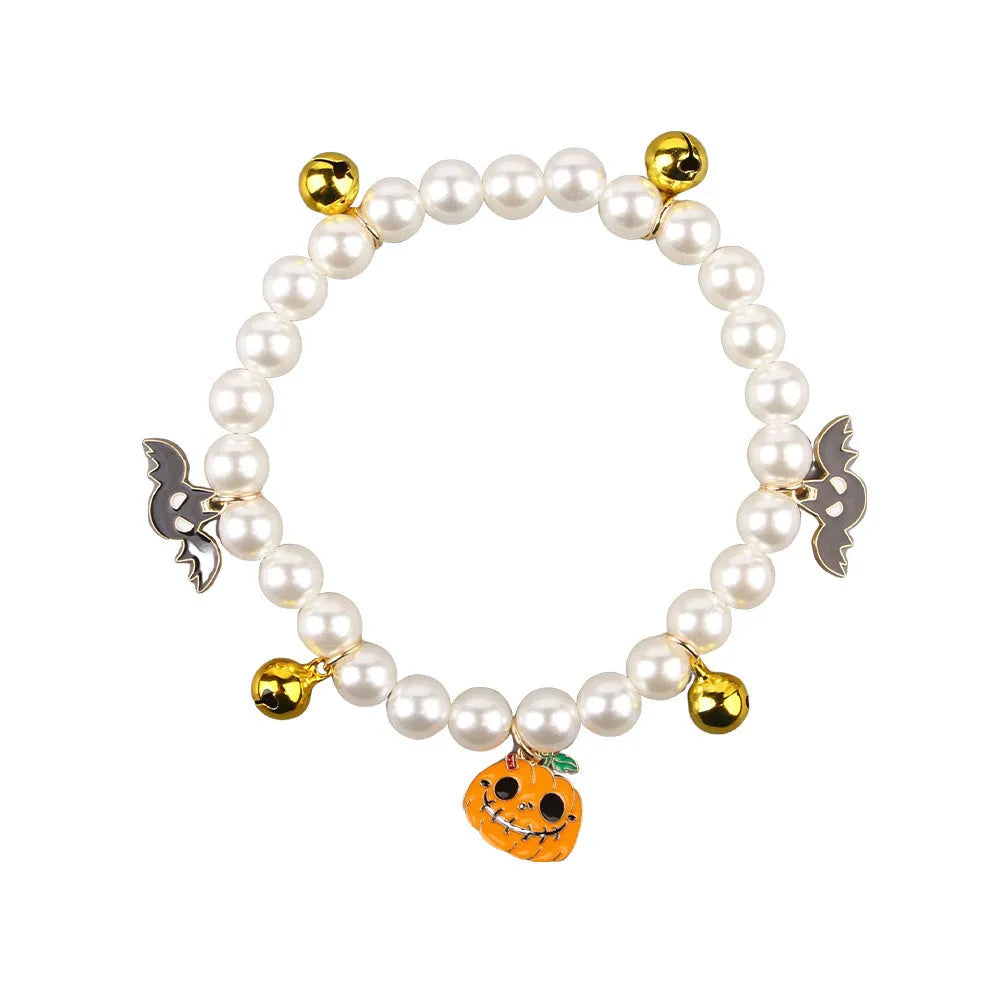 Purple Halloween cat collar decoration with simulated pearl necklace and pumpkin charm design