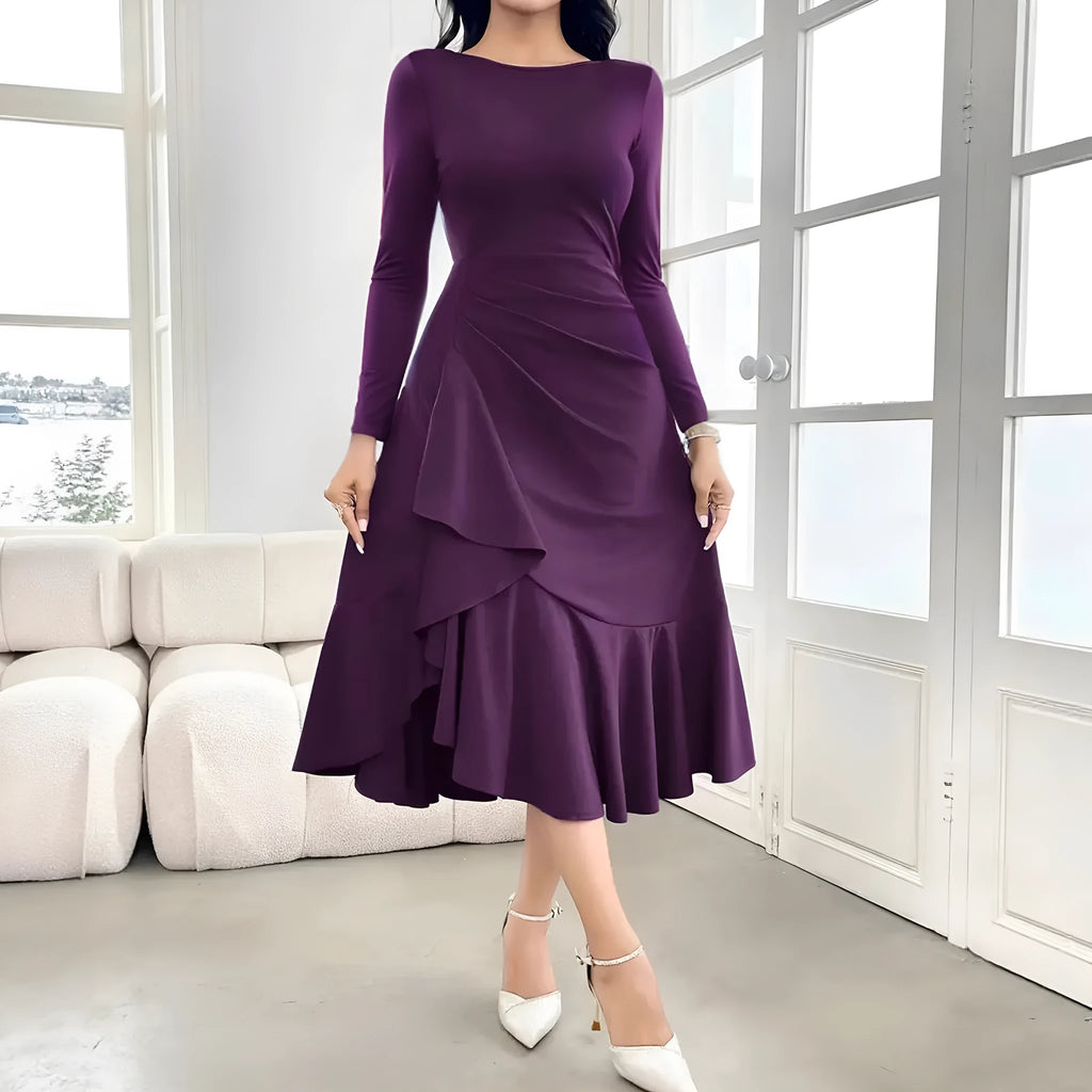 Purple women's long sleeve dress with ruffles and a round neck, shown on a mid-waist fit model.