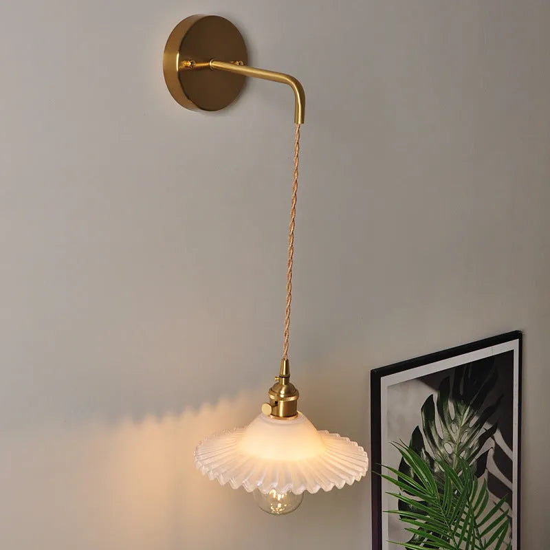 Retro brass bedside lotus wall lamp with glass shade in one of six colours