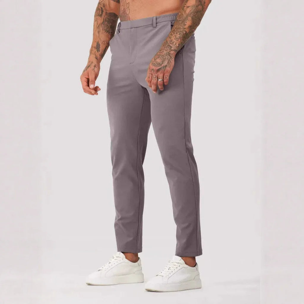 Men's solid colour suit trousers in mid waist, straight leg, small feet opening, polyester blend, available in five colours.