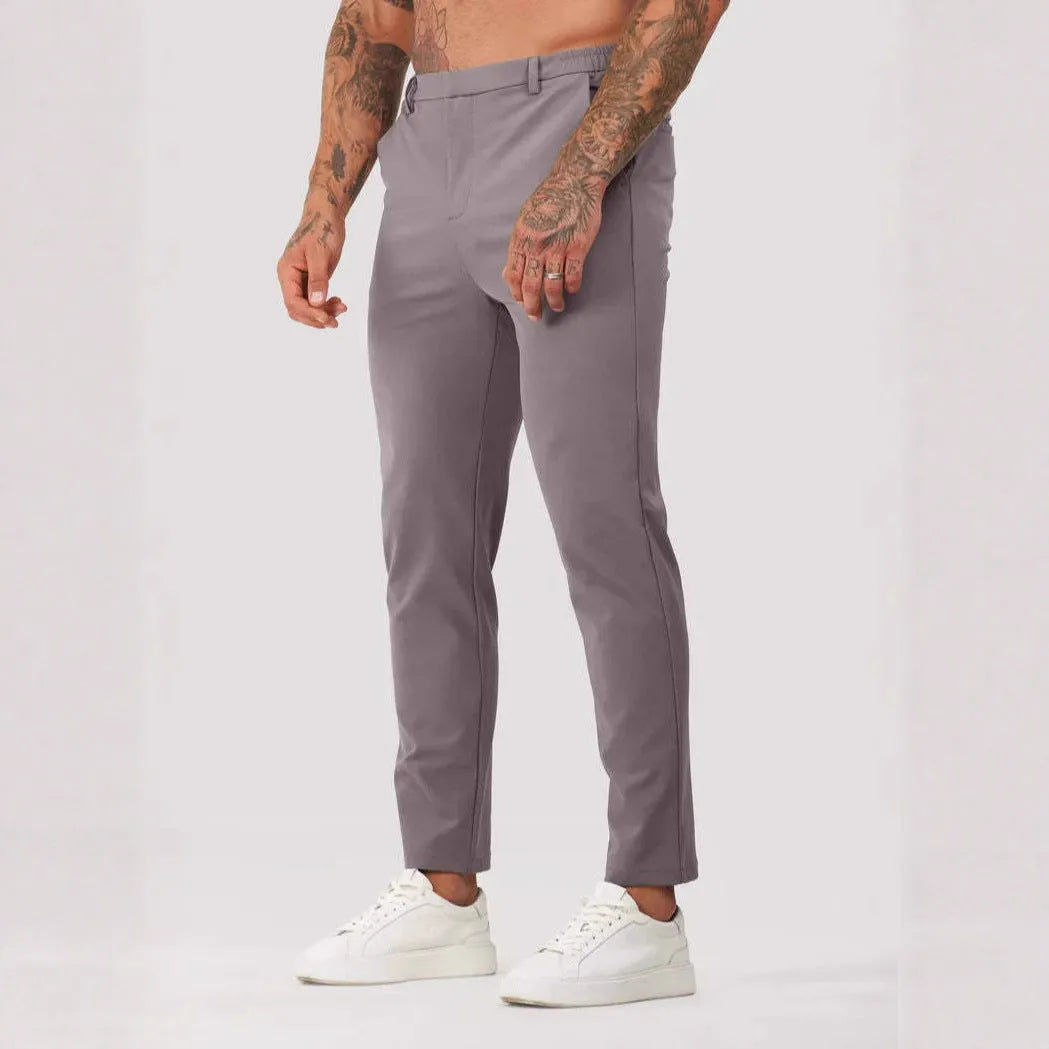 Men's solid colour suit trousers in mid waist, straight leg, small feet opening, polyester blend, available in five colours.
