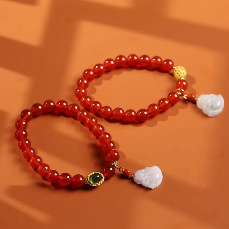 Chinese style women's bracelet with natural amber, red agate beads and gold Buddha charm