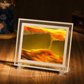 Modern geometric glass quicksand painting ornament with landscape scene on a shelf.