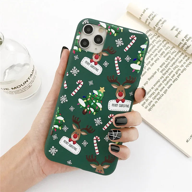 Green TPU iPhone case with cartoon Christmas elk, tree, and stripe design.