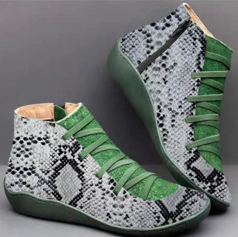 Women's casual flat booties with a wedge heel and round toe in various colours.