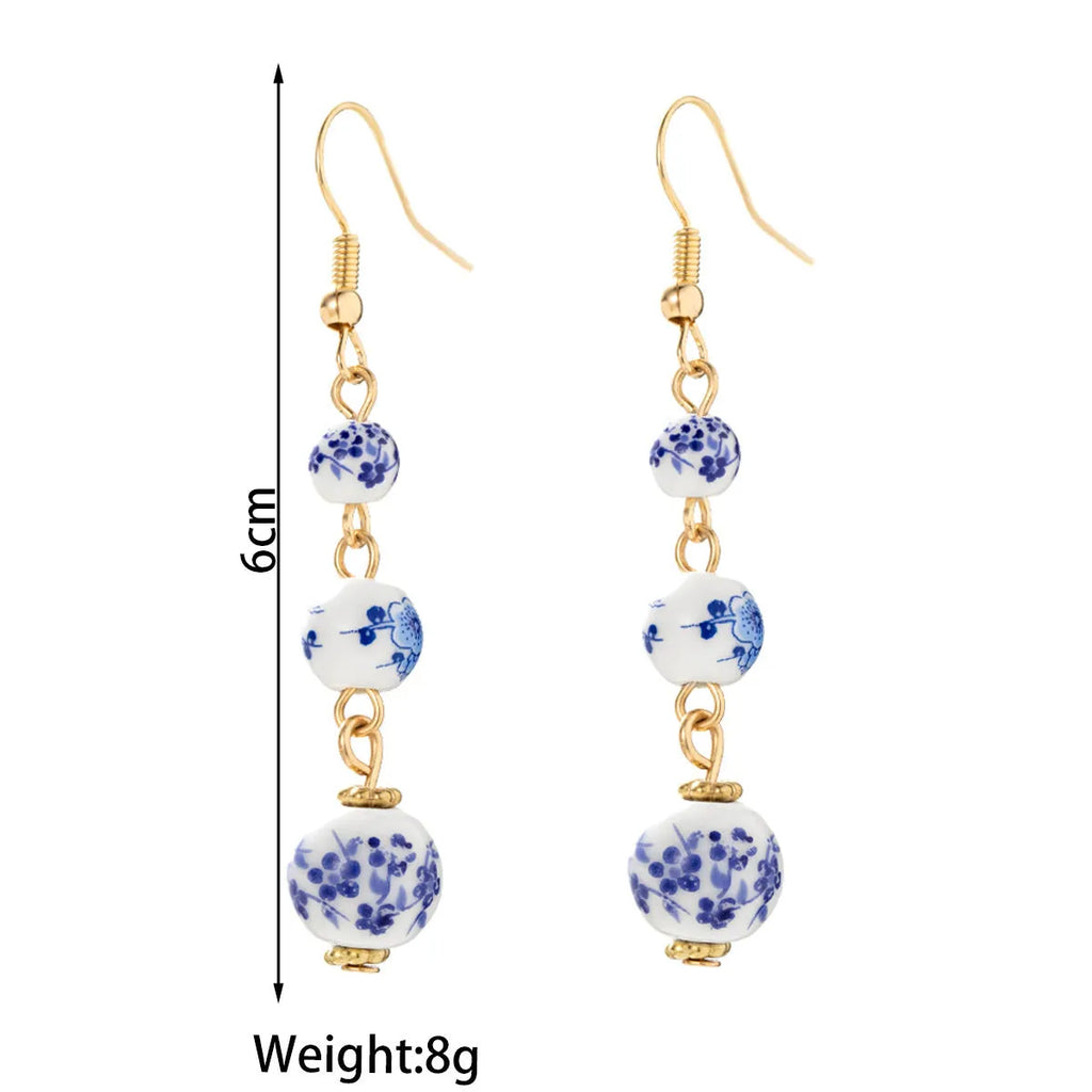 Blue and white porcelain ceramic bead geometric retro earrings with alloy electroplated finish
