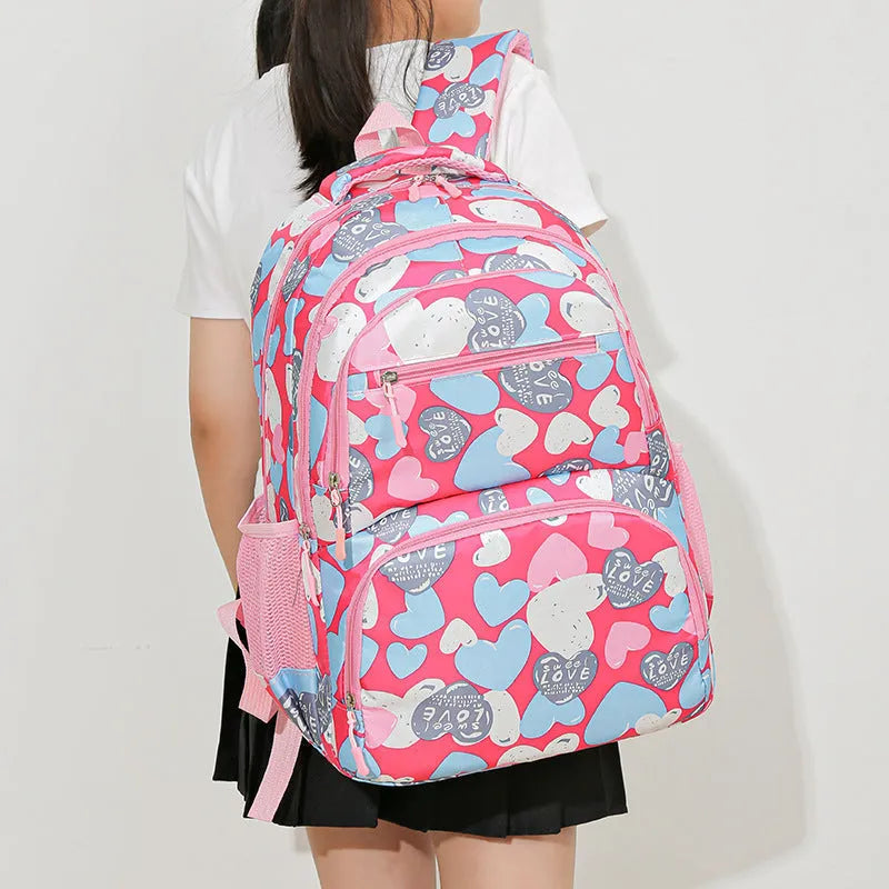 Blue student school backpack with air pillow belt straps and large main compartment.