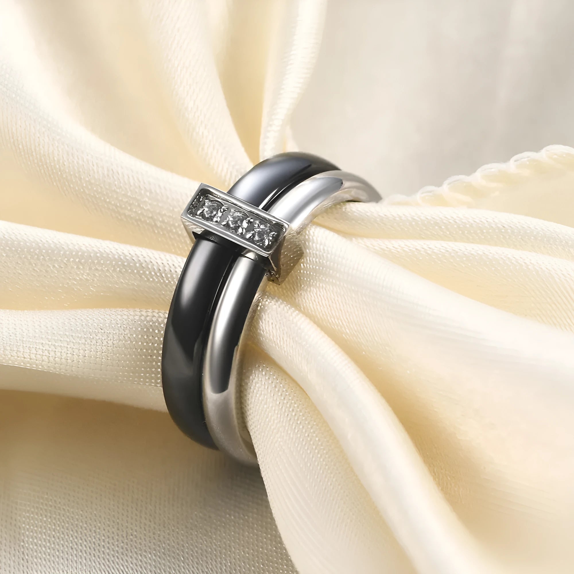 Ceramic geometric ring with glossy stitching and zirconium detail in steel black finish