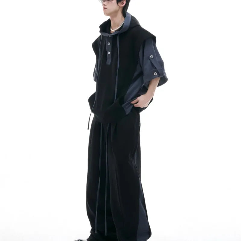 Men's black polyester sports suit with hooded jacket featuring three-dimensional stitching and matching trousers