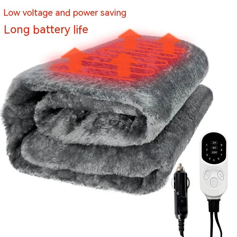 Grey 12V car electric blanket with digital controller, shown plugged into a car cigarette lighter socket.