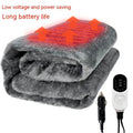 Grey 12V car electric blanket with digital controller, shown plugged into a car cigarette lighter socket.