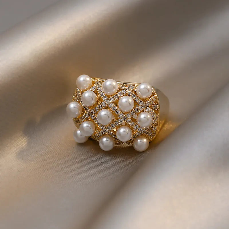 Copper zircon pearl geometric ring with 14K gold electroplated finish and adjustable opening for women.
