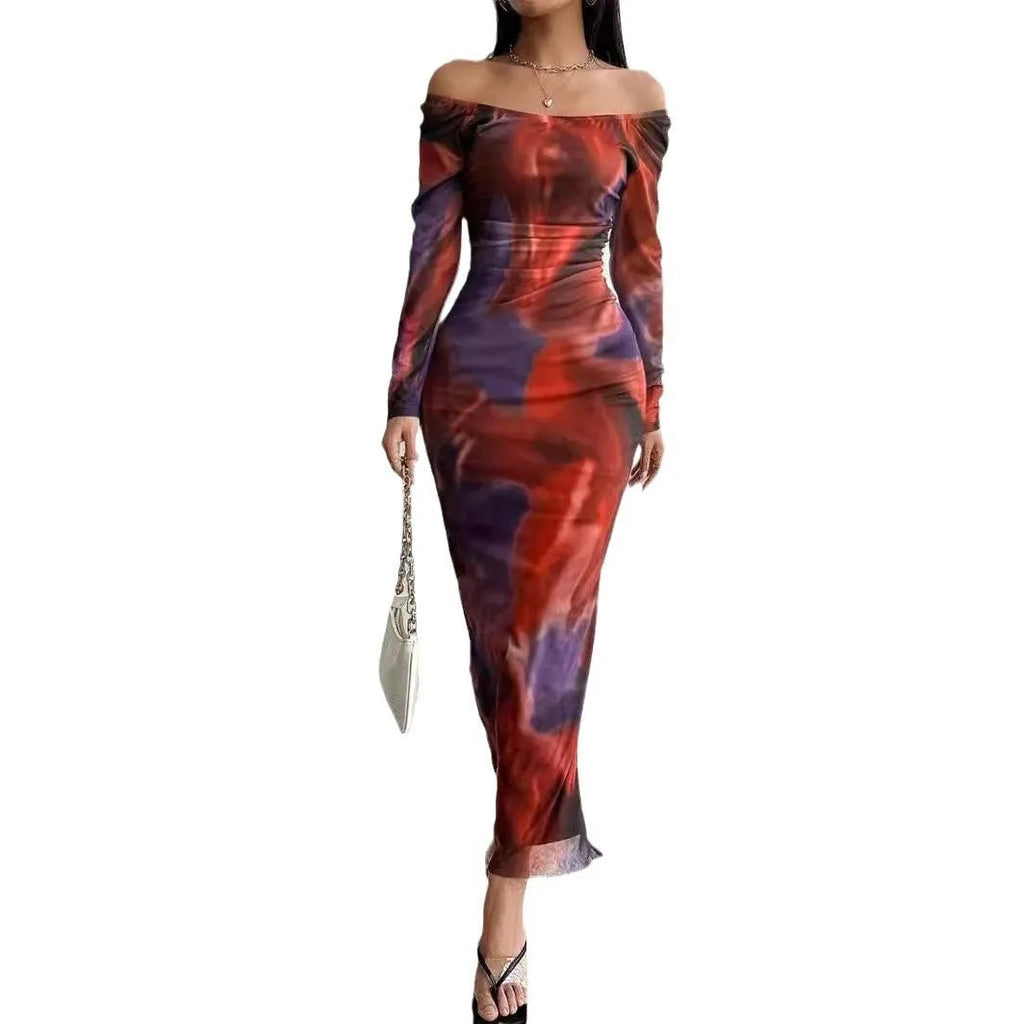 Long green gradient fishtail mesh dress with a square collar and pleated detailing on a mannequin.