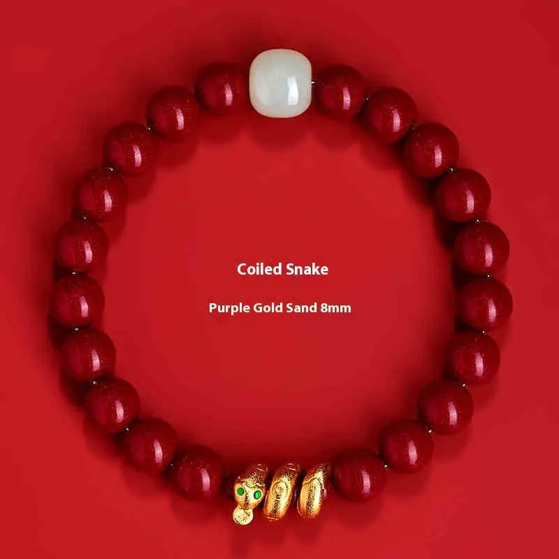 Close-up of a handmade cinnabar bracelet with snake zodiac beads in a Chinese style.