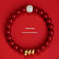 Close-up of a handmade cinnabar bracelet with snake zodiac beads in a Chinese style.