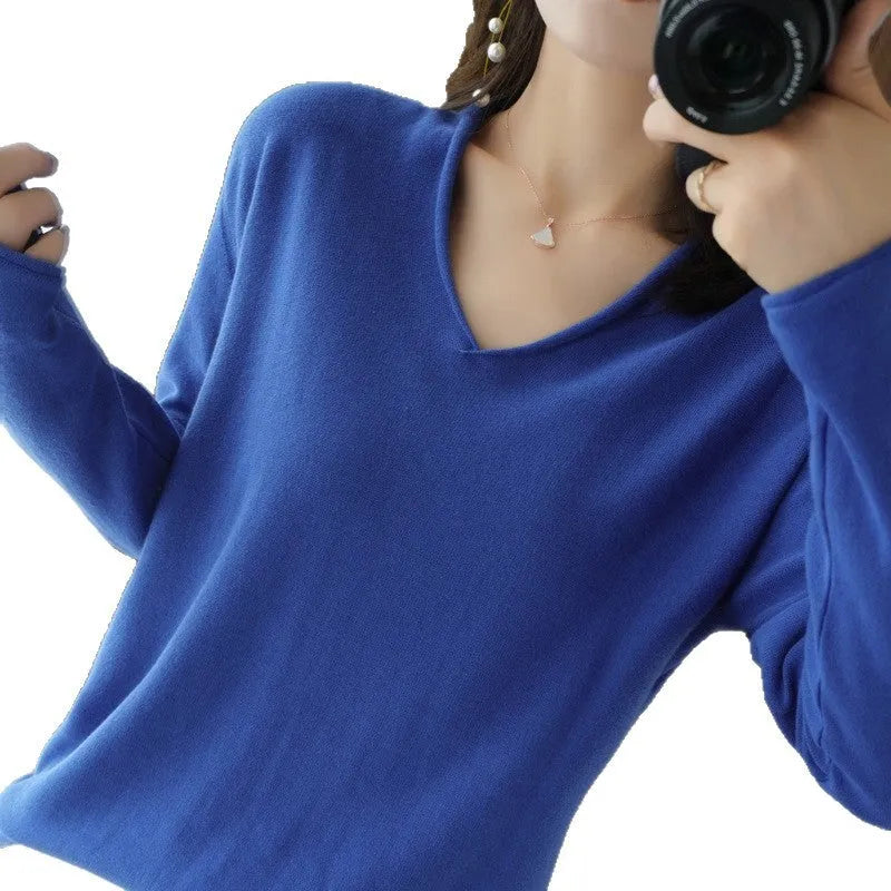 Women's V-neck long sleeve knitwear top in turmeric colour on a hanger