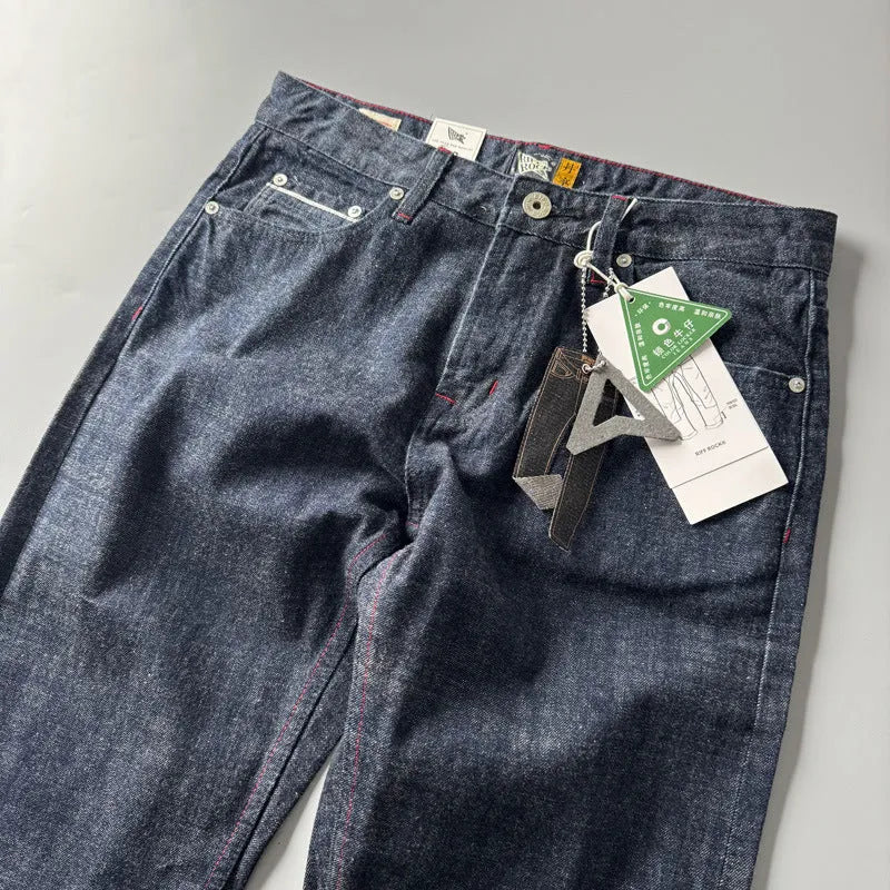 Men's straight leg cotton denim trousers in primary colour with mid-rise waist and retro American style.