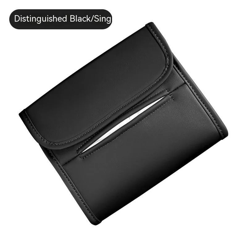 Brown leather car tissue box with elastic strap hanging on a car armrest