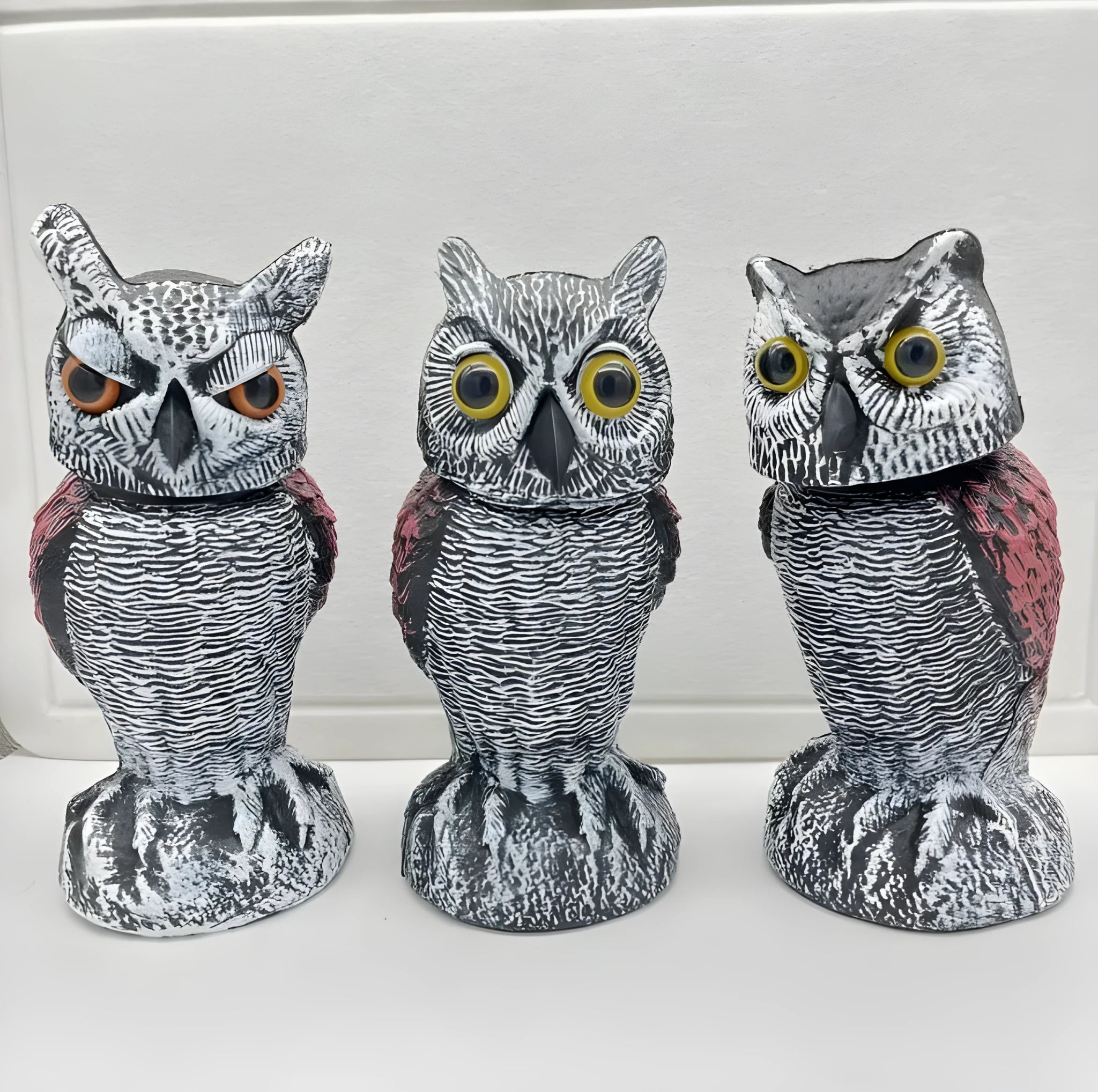 PE plastic artificial owl decoy ornament for scaring birds outdoors, shown in packaging.