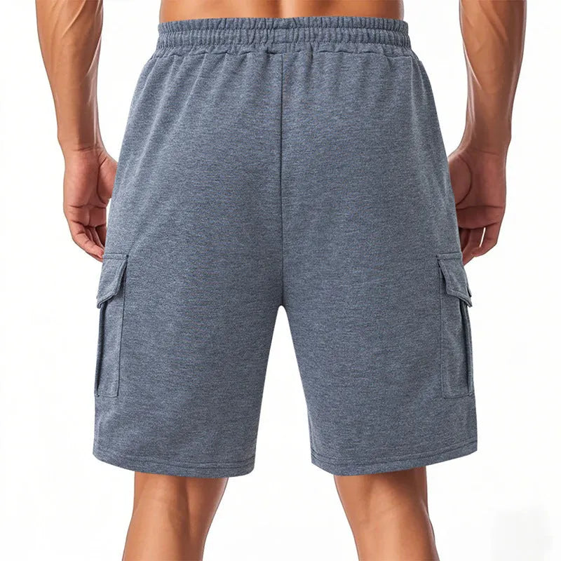 Men's loose-fit light grey cargo shorts with multiple pockets made from a towel terry fabric.