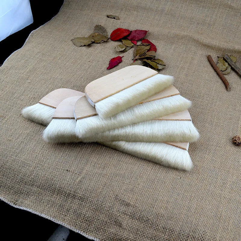 Wool art mounting brush in four different sizes for paste application and board shading