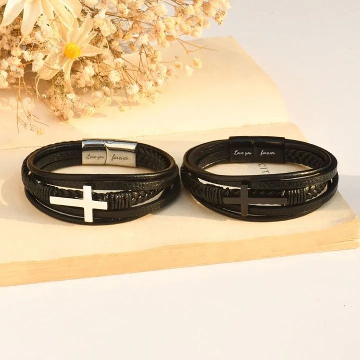 Men's stainless steel cross bracelet with leather band and plated finish, shown in steel and black colour options