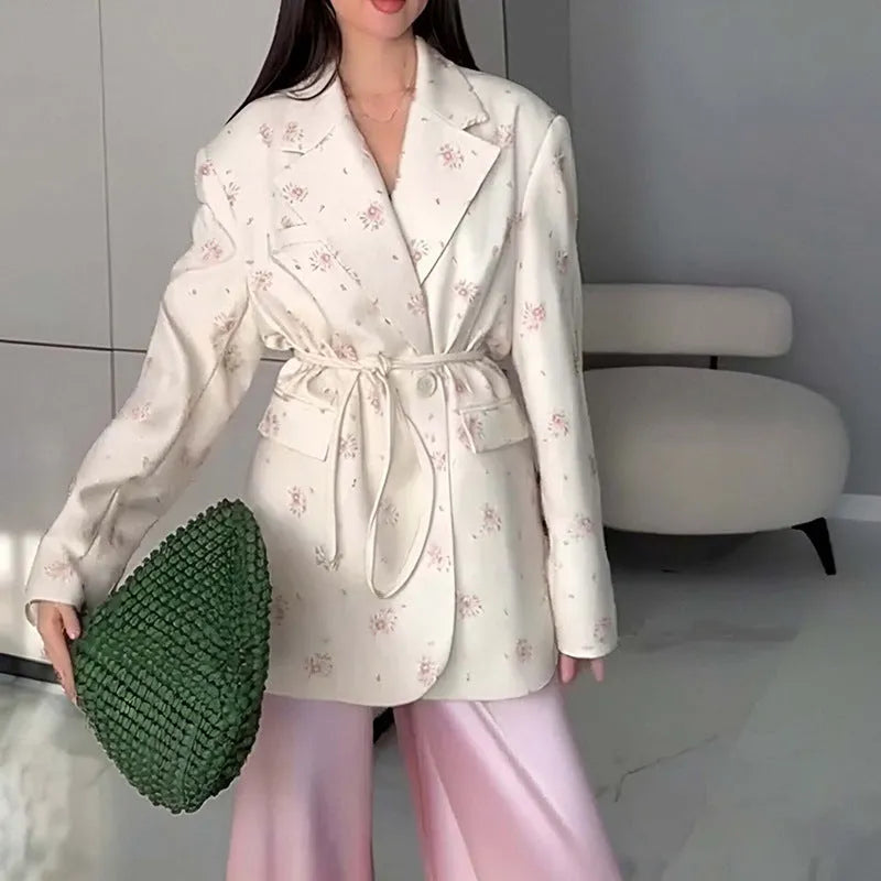 Women's white suit jacket with lace-up waist detail and collar, shown in regular fit with long sleeves