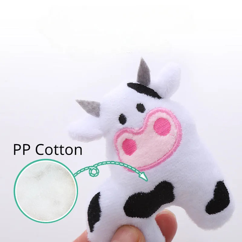 Plush cat toy shaped like a cow, crocodile, or parrot on a plain background.