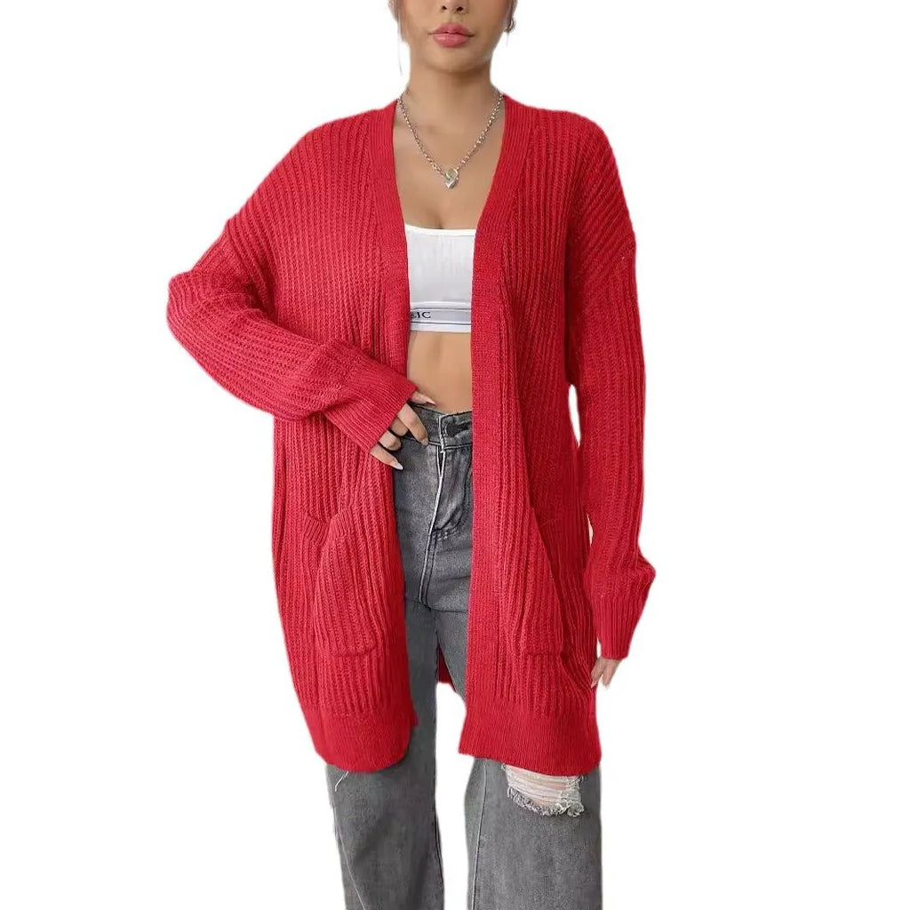 Women's dark green acrylic cardigan sweater with two pockets and long sleeves.