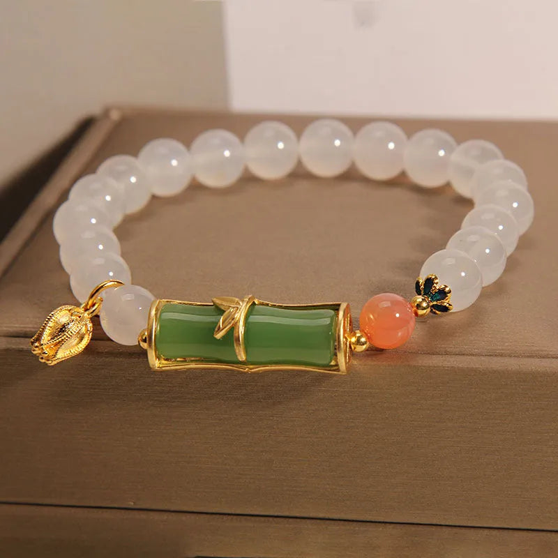 Women's white agate jade bead bracelet with bamboo joint beading in a retro Chinese style.